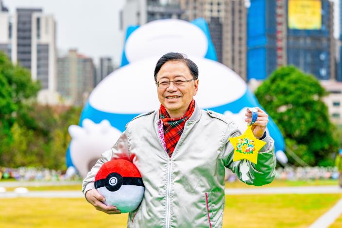 Mayor Chang holding a Pokémon lantern